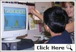 Picture of a student using a computer program to learn about counting Picture of a student using a computer program to learn about counting